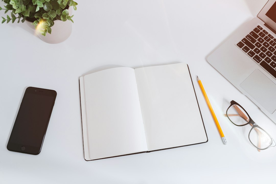 Minimal workspace with laptop and planning notes representing focused affiliate marketing execution